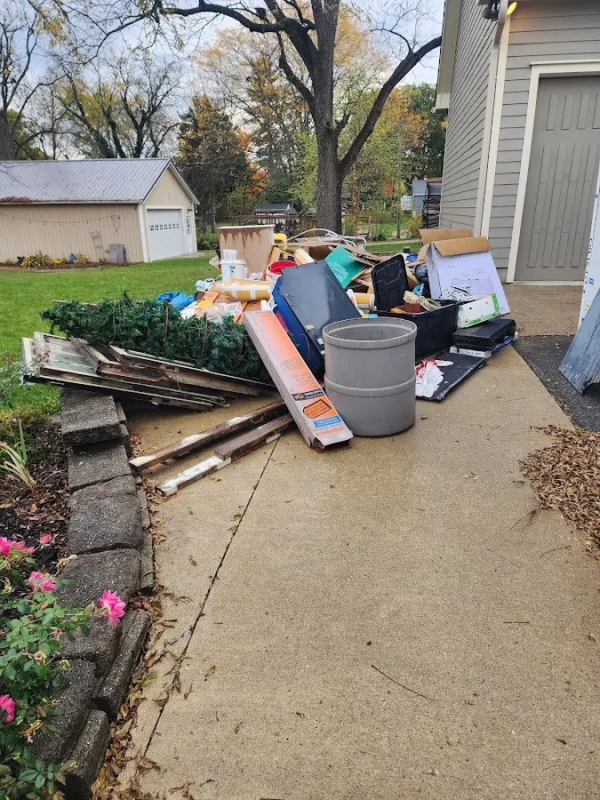 Dumpster being loaded with debris for 12 Yard Dumpster Rental in Ohioville